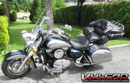 2005 Kawasaki Vulcan 1600D1 Nomad with the following modifications made in April and May 2012:

Cobra Driving Lights with Covers, BrakeAway Cruise Control, Wolo 419 Bad Boy Dual Tone Horn, Ultimate Seats - Mid Rider and Passenger Seat & Rider backrest, Passenger Floor Boards relocation kit from David J PARSONS, Kuryakyn Dually Foot Pegs, Wompus Rack for the Power Products Chopped Tour Pack with built in wing by Scoop Engineering that has a Luggage Rack, Wrap around backrest with speaker pods & Alpine speakers, Classic Chaps for Stock Crash Bars, Metzeler ME 880 Marathon tires, Vance & Hines Dual Bagger Exhaust with Smart Parts Quiet Baffles, Kuryakyn Eagle Fender Ornament, Scootworks PhatRiser 1X